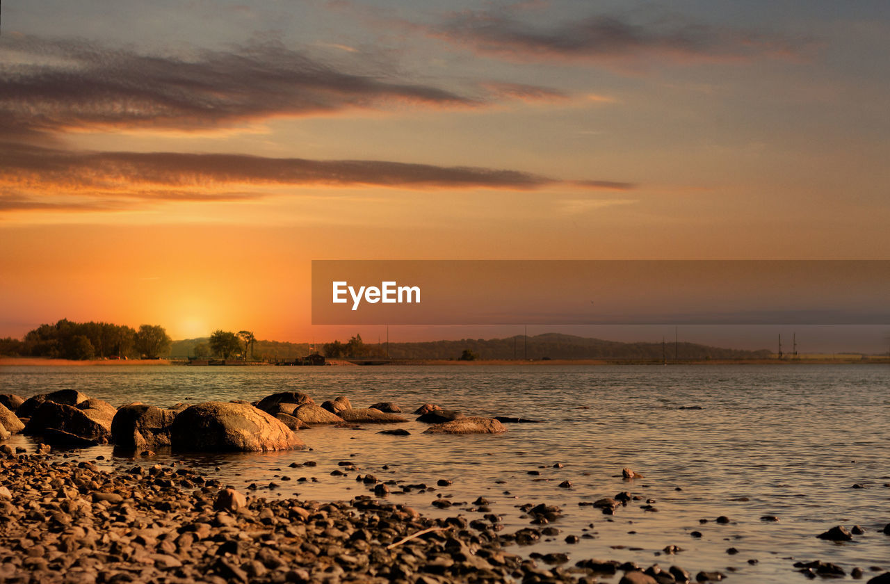 Scenic view of sea against sky during sunset