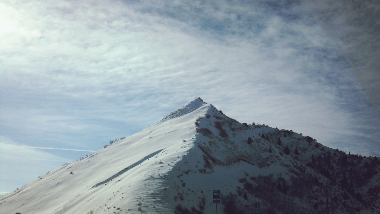 Low angle view of mountain peak against sky