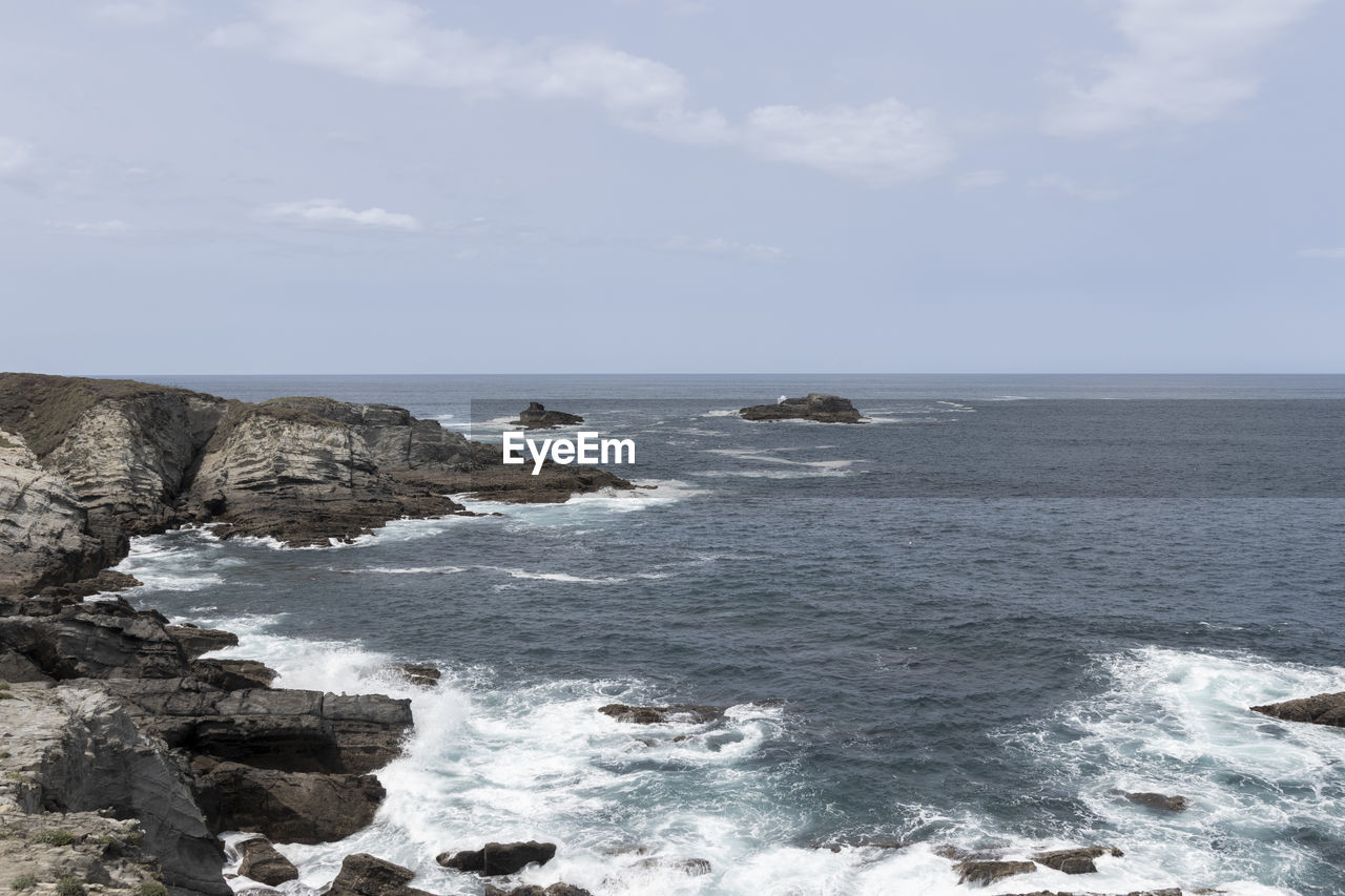 sea, water, sky, beauty in nature, scenics - nature, rock, land, beach, shore, horizon, horizon over water, nature, body of water, ocean, cloud, coast, wave, day, tranquility, tranquil scene, no people, motion, cliff, wind wave, outdoors, non-urban scene, idyllic, rock formation, sports, cove, bay, water sports, terrain