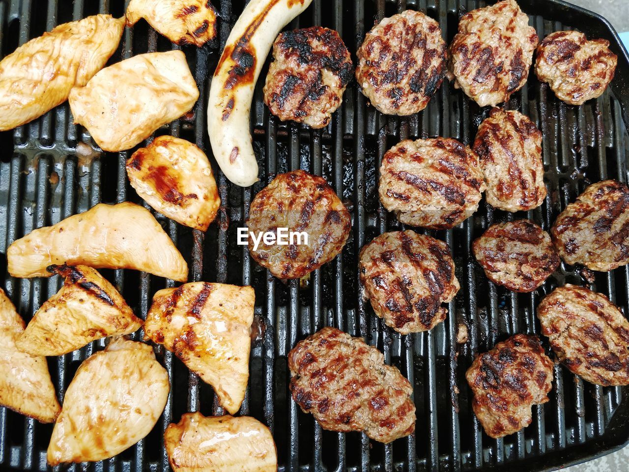 Full frame shot of meat on barbecue grill