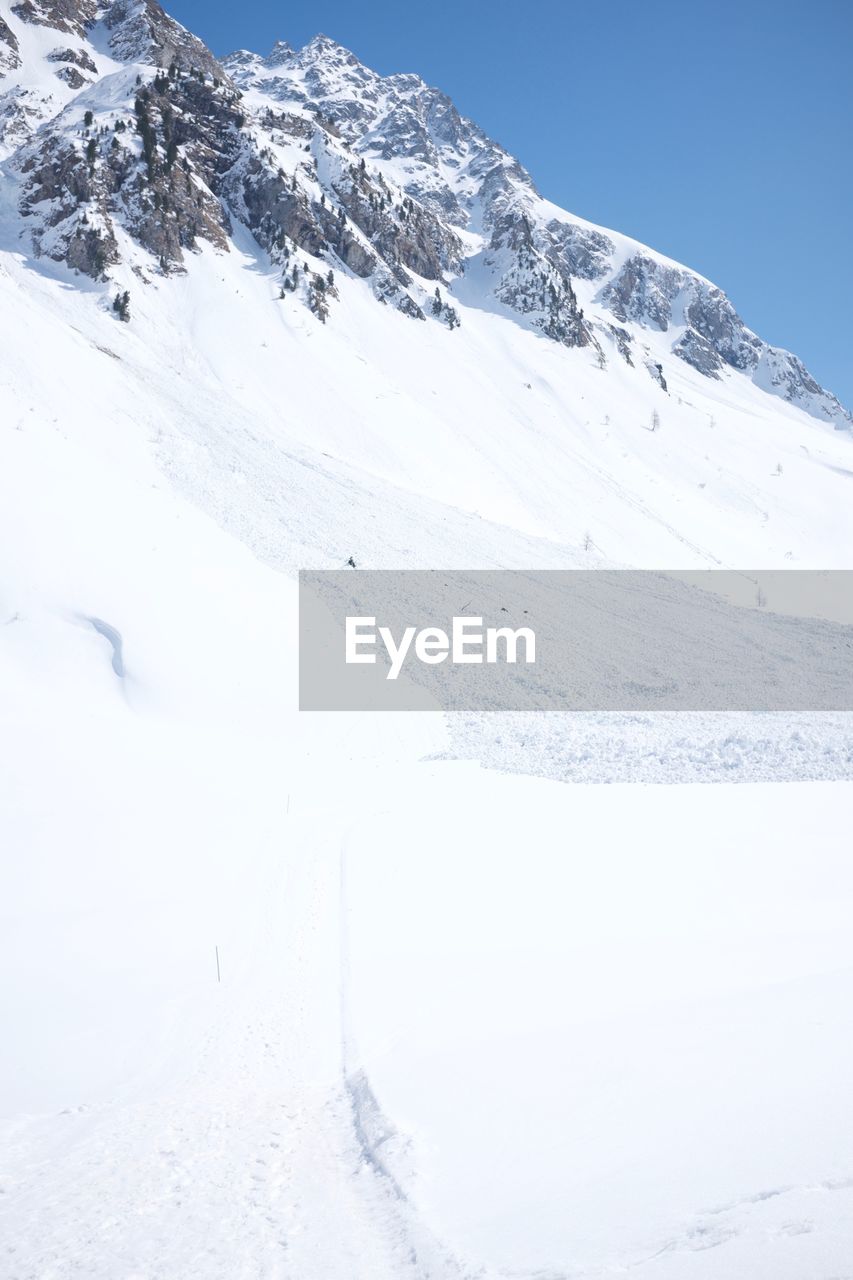 Snow covered mountains against sky