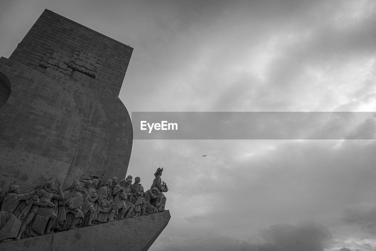 Low angle view of monument celebrating the portuguese discoveries  against sky