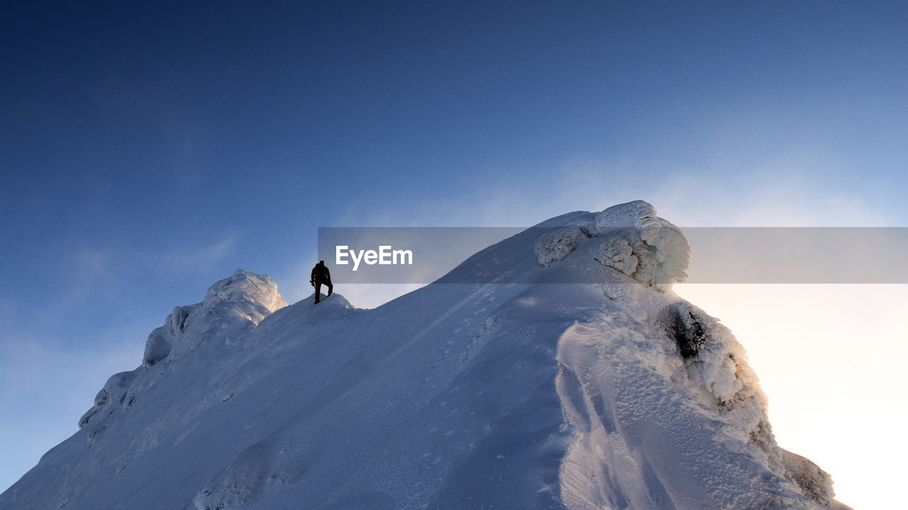 LOW ANGLE VIEW OF MOUNTAIN AGAINST CLEAR SKY