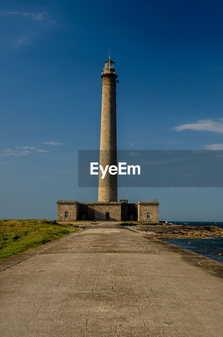 LIGHTHOUSE AGAINST SKY AT SEA