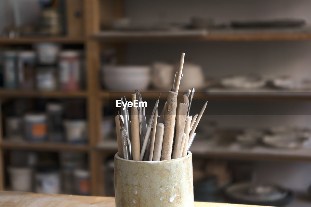 Ceramic working tools. art craft sculpting tools brush in a pottery workshop.