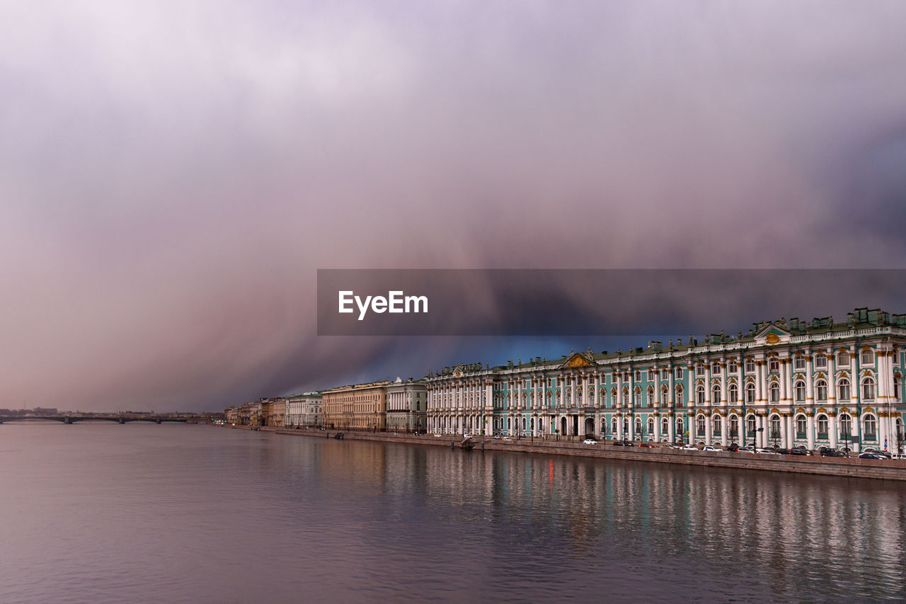 Dramatic sunset and weather front with snow storm risk in spring over hermitage in st. petersburg. 