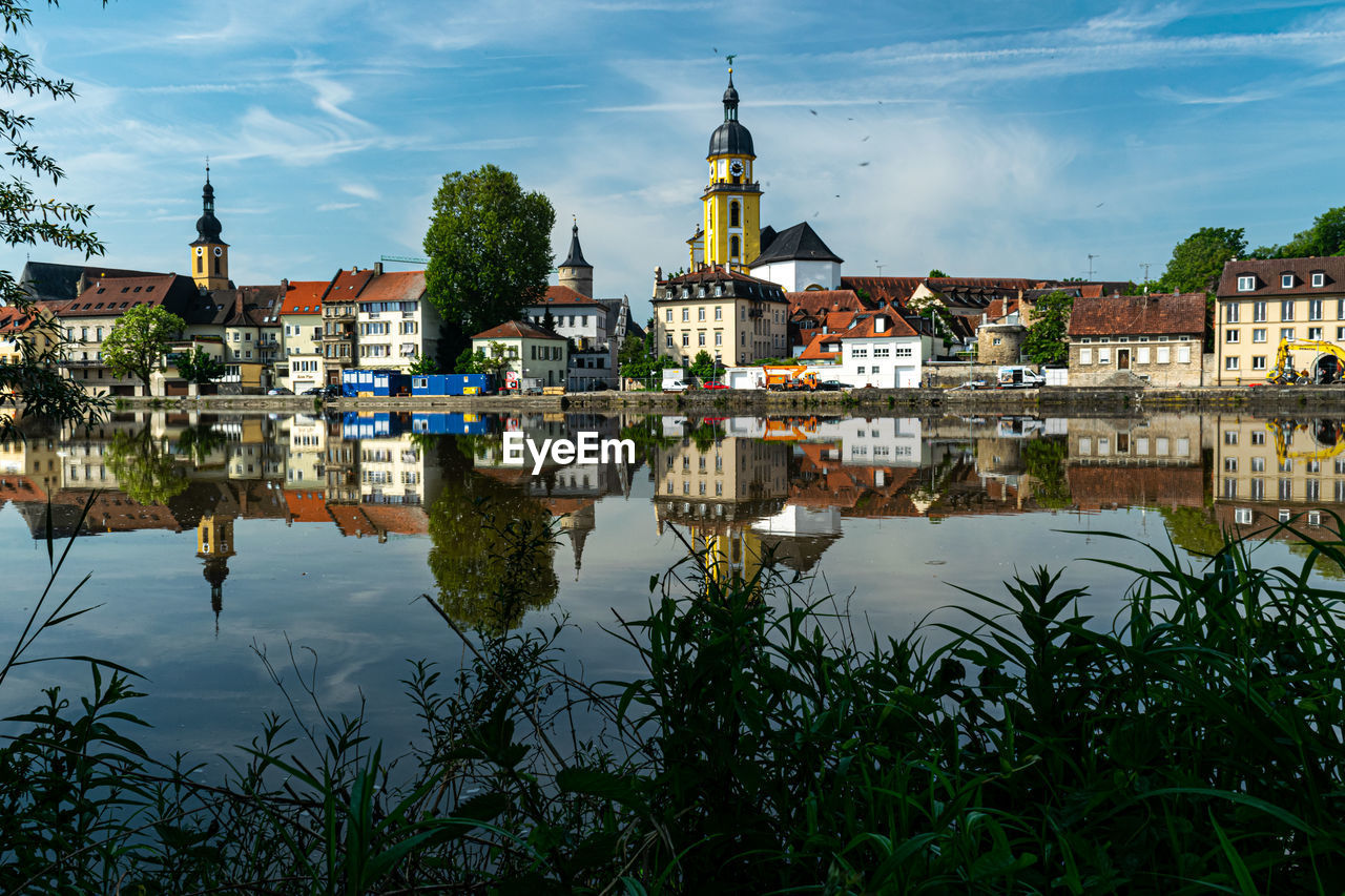 Reflection of the city building in the water 