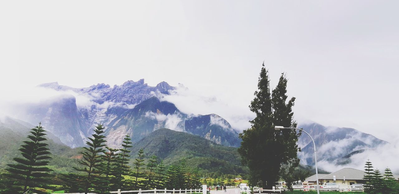 Scenic view of snow covered mountain against sky