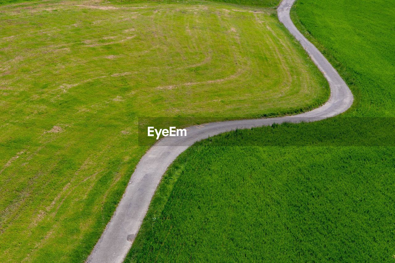 High angle view of road amidst field