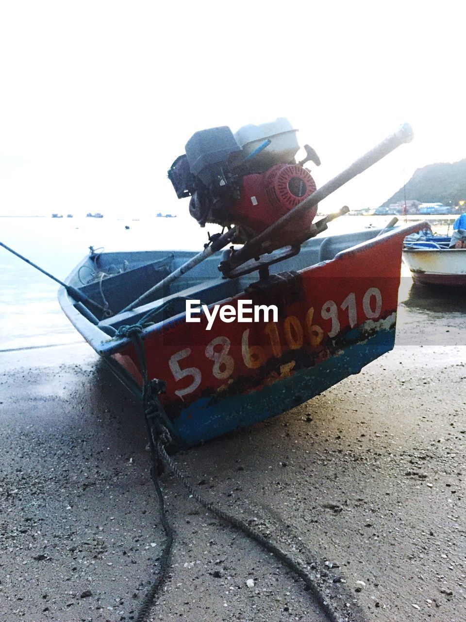 CLOSE-UP OF BOAT ON BEACH