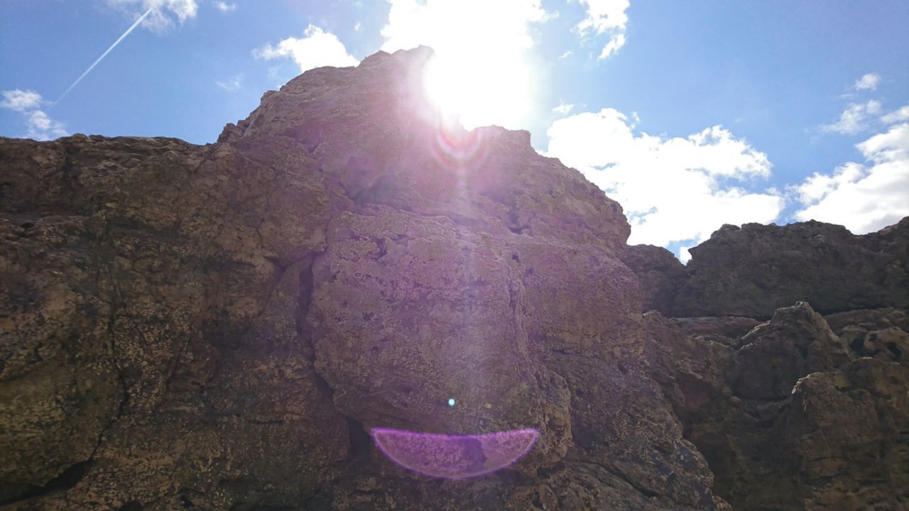 MAN IN MOUNTAIN AGAINST SKY