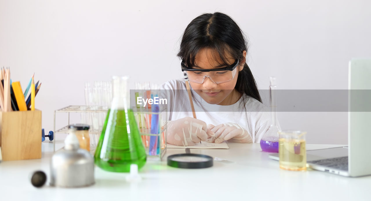 Girl experimenting at laboratory