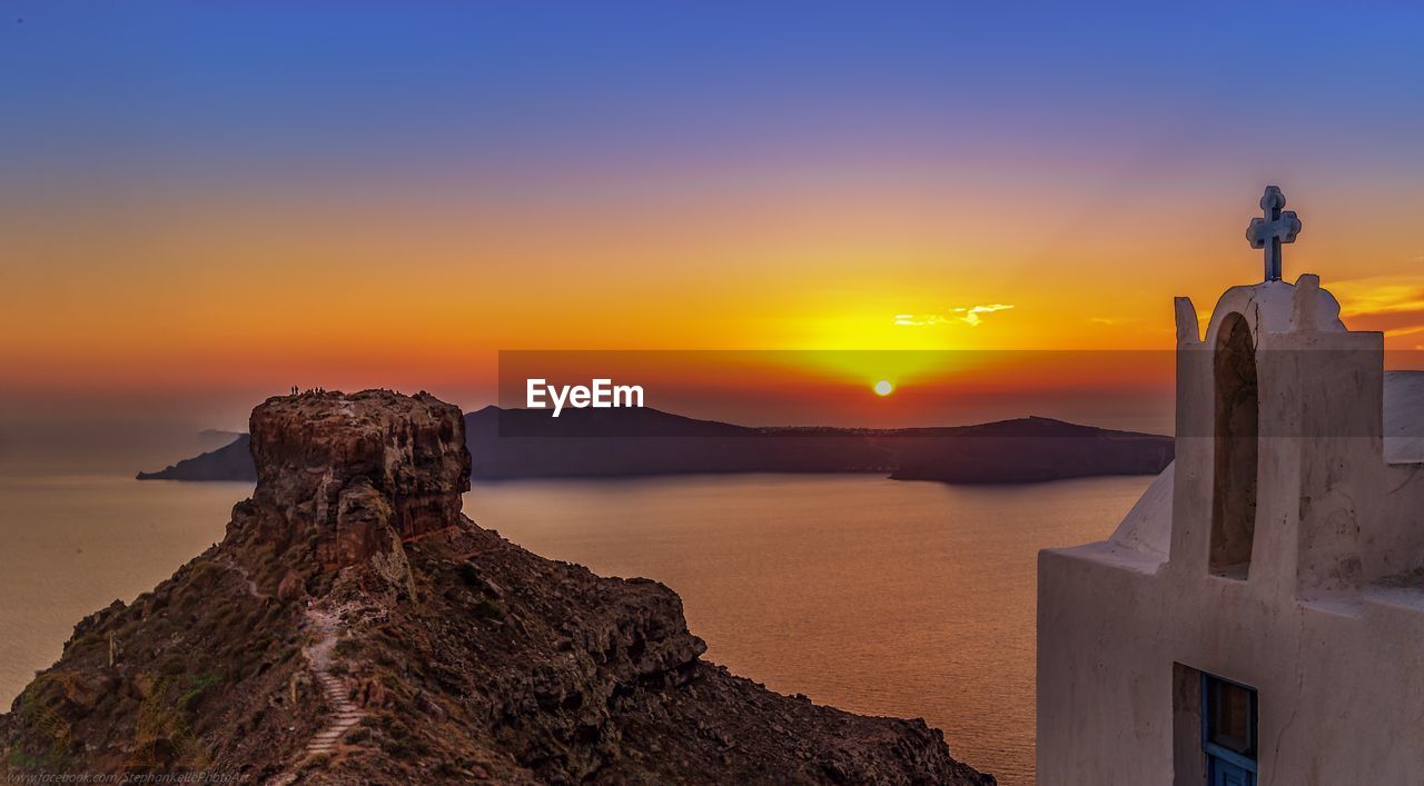 Scenic view of aegean sea against sky during sunset seen from santorini