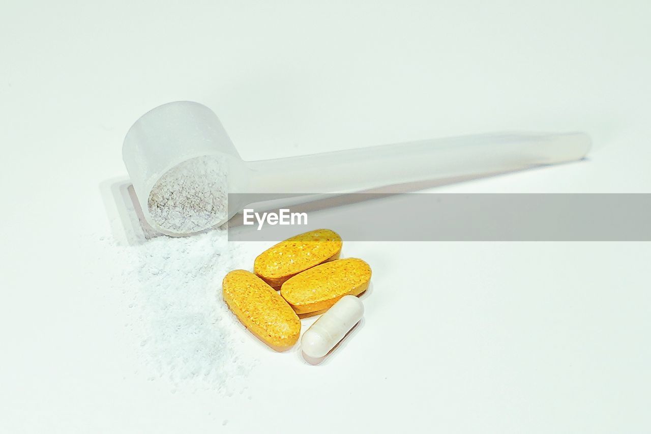 High angle view of medicines on white background