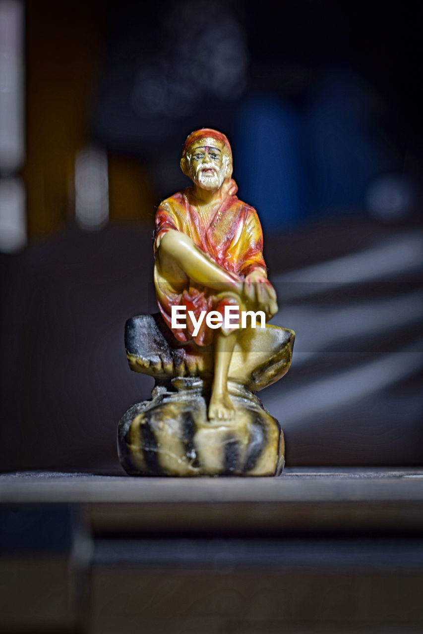 Sai baba idol statue on table