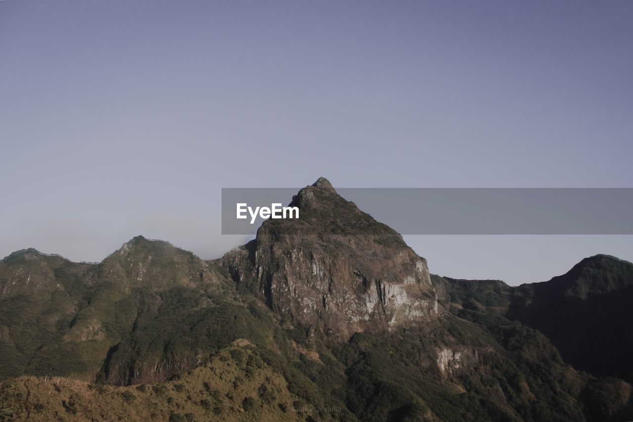 SCENIC VIEW OF ROCKS AGAINST CLEAR SKY