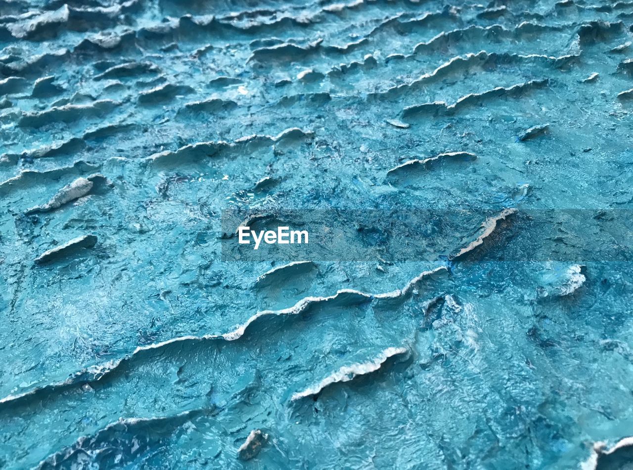 FULL FRAME SHOT OF FROZEN BLUE WALL