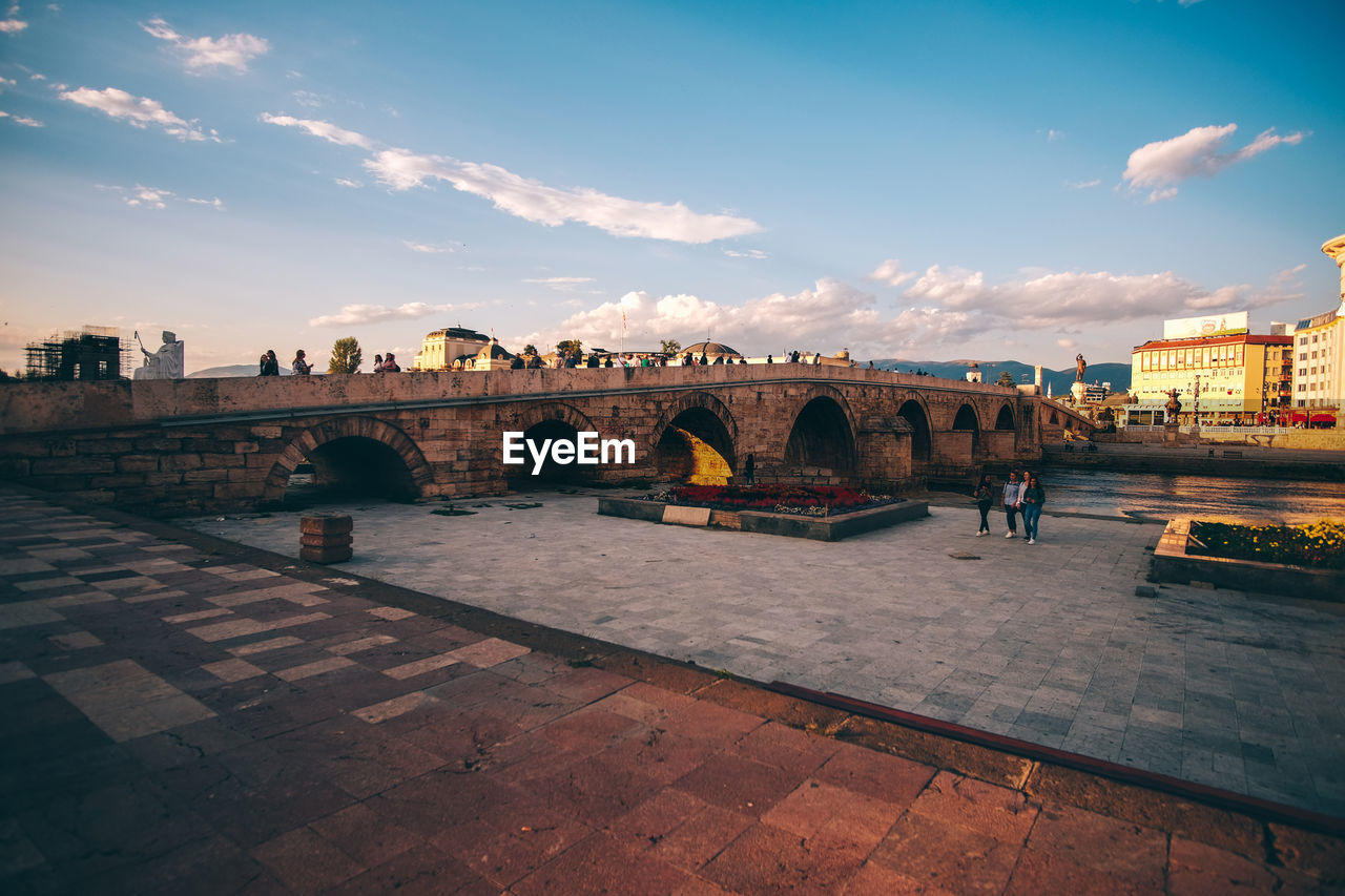 View of bridge over river against cloudy sky