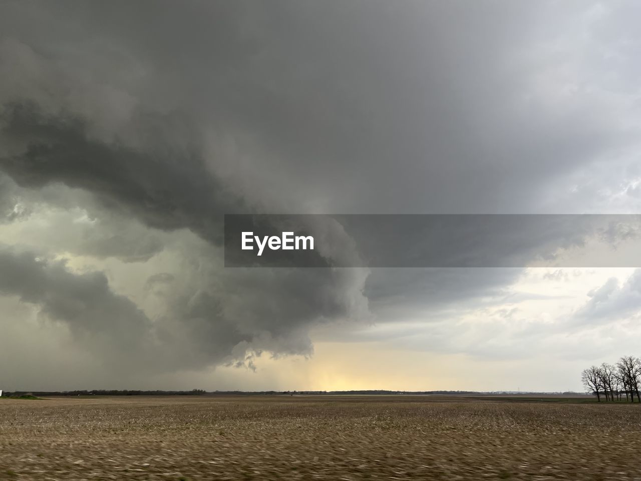 cloud, storm, thunderstorm, sky, environment, storm cloud, landscape, dramatic sky, beauty in nature, nature, extreme weather, wet, power in nature, land, rain, tornado, field, warning sign, cloudscape, no people, sign, horizon over land, overcast, plain, outdoors, ominous, scenics - nature, cumulonimbus, horizon, prairie, threats, rural scene, lightning, day, plant, monsoon, risk, accidents and disasters