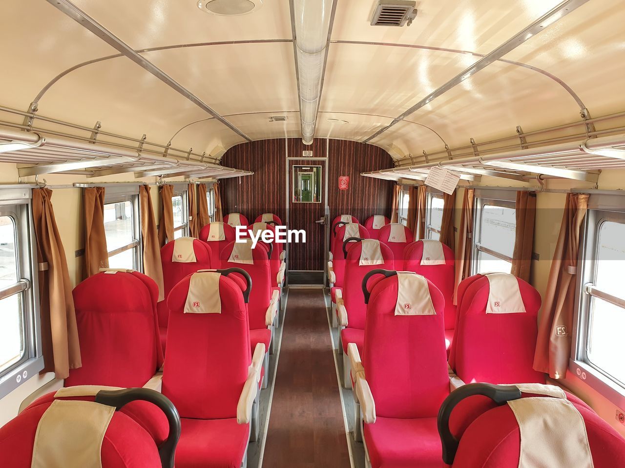 vehicle interior, seat, vehicle seat, transportation, mode of transportation, vehicle, travel, public transportation, transport, rail transportation, window, airplane, train, indoors, red, journey, in a row, empty, passenger cabin, no people, public transport, land vehicle, absence, bus, subway train, city, air vehicle