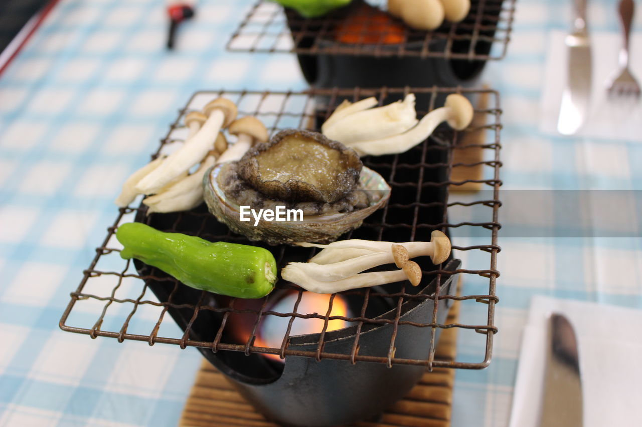 High angle view of abalone grilled on table