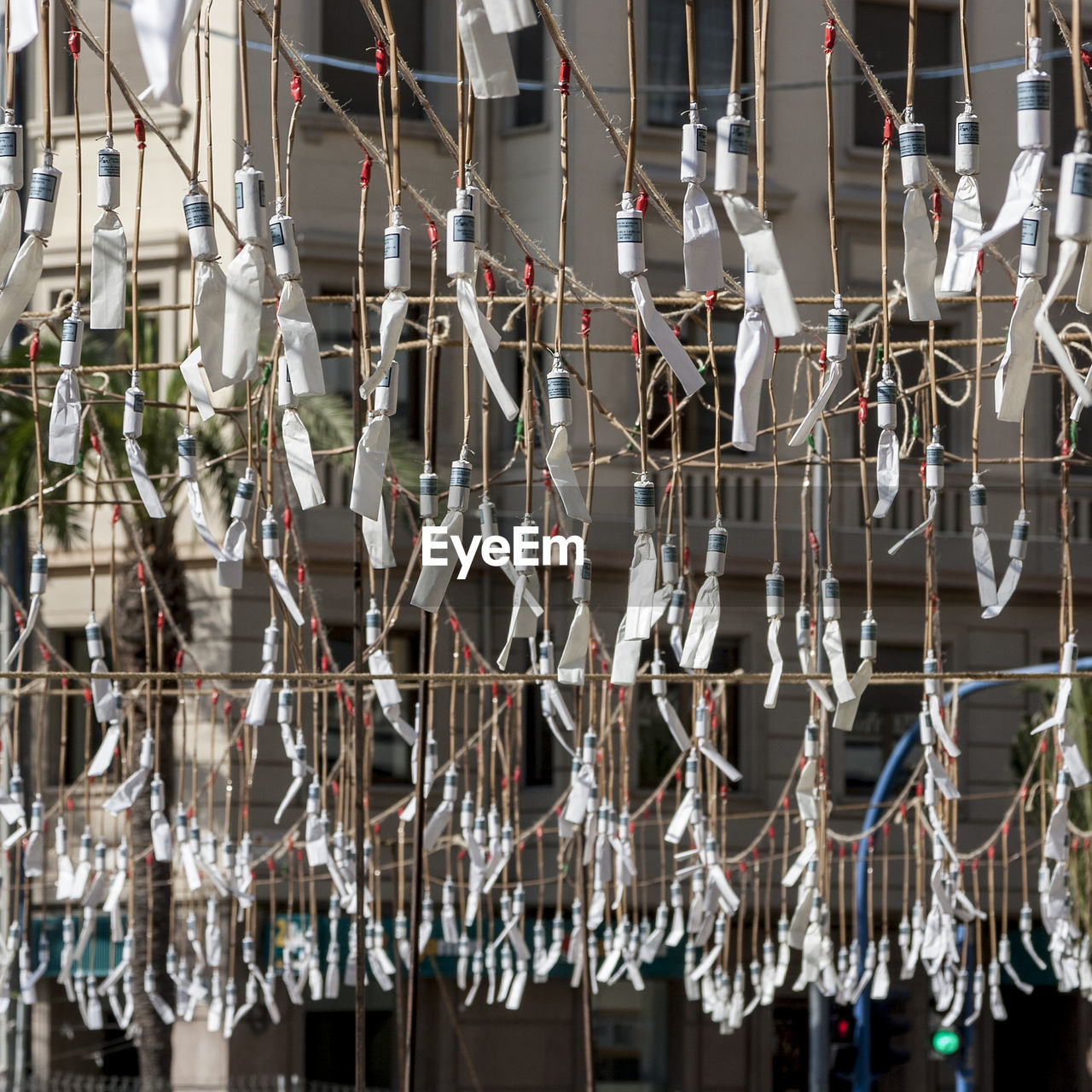 LOW ANGLE VIEW OF TIED HANGING ON CEILING OF BUILDING