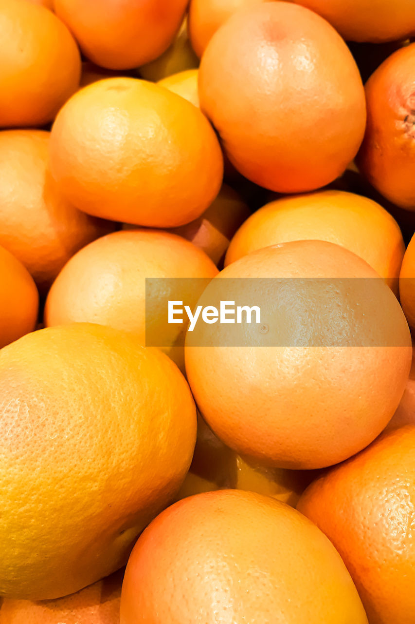 Ripe yellow tangerines at farmers market. organic eco food. selling fruit in the supermarket.