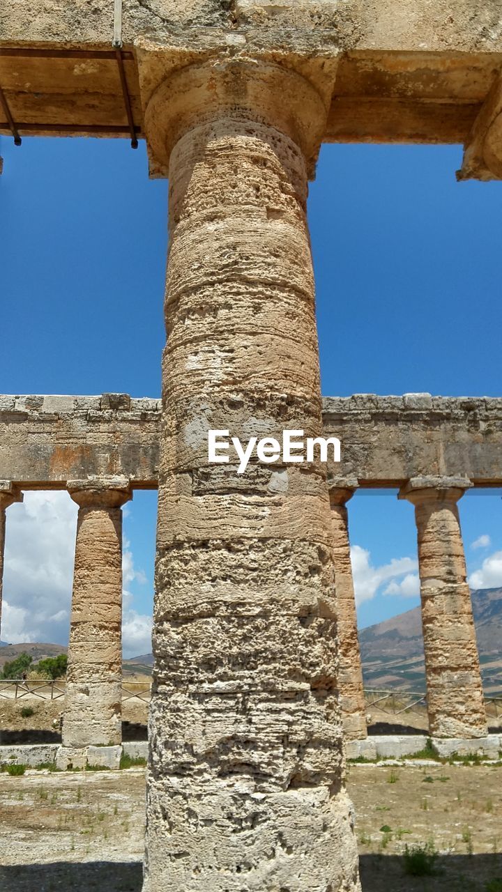 ARCHITECTURAL COLUMNS AGAINST SKY