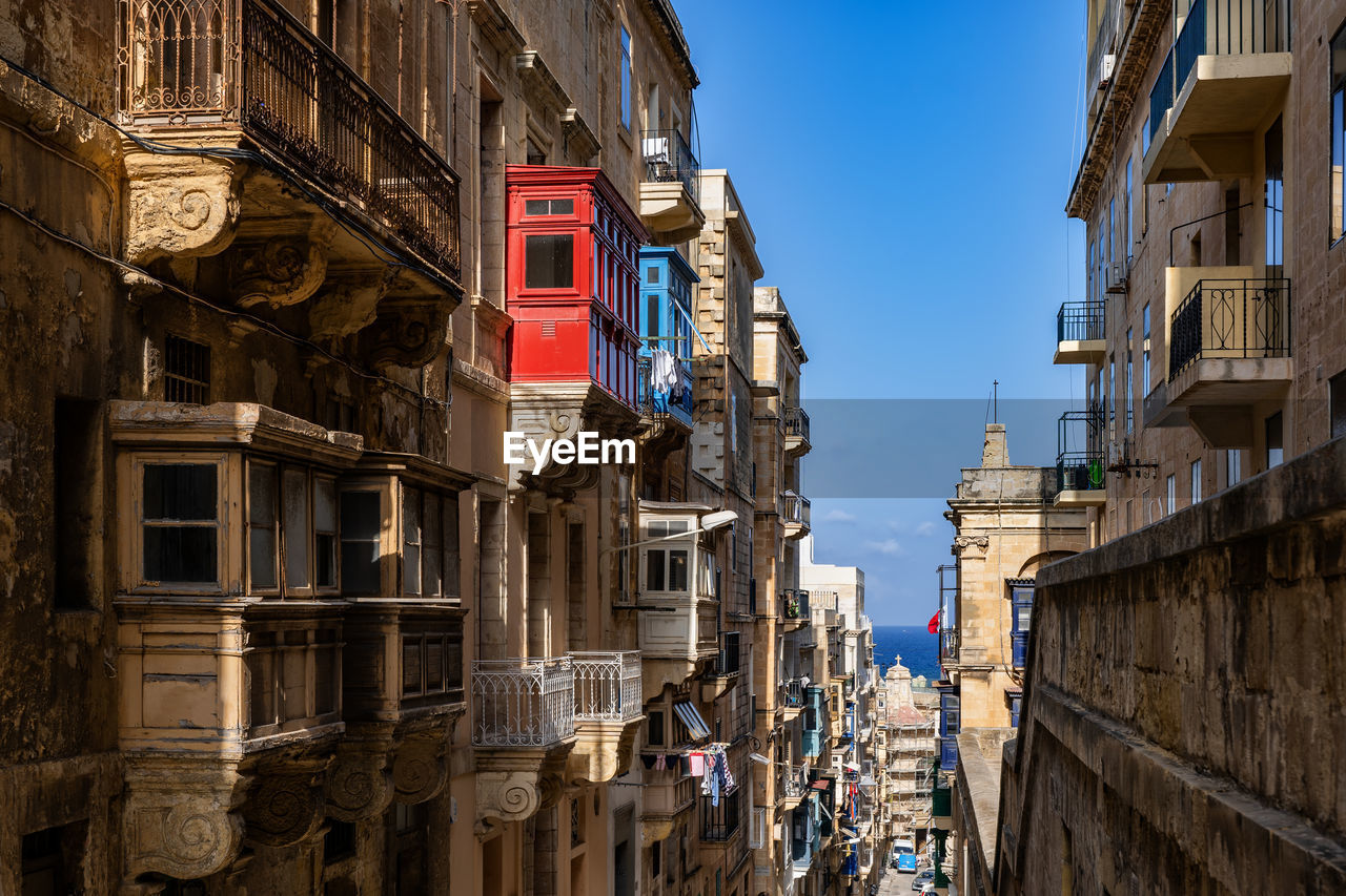 Buildings against blue sky in city