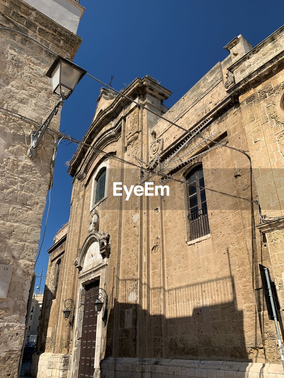 Low angle view of old building against clear sky