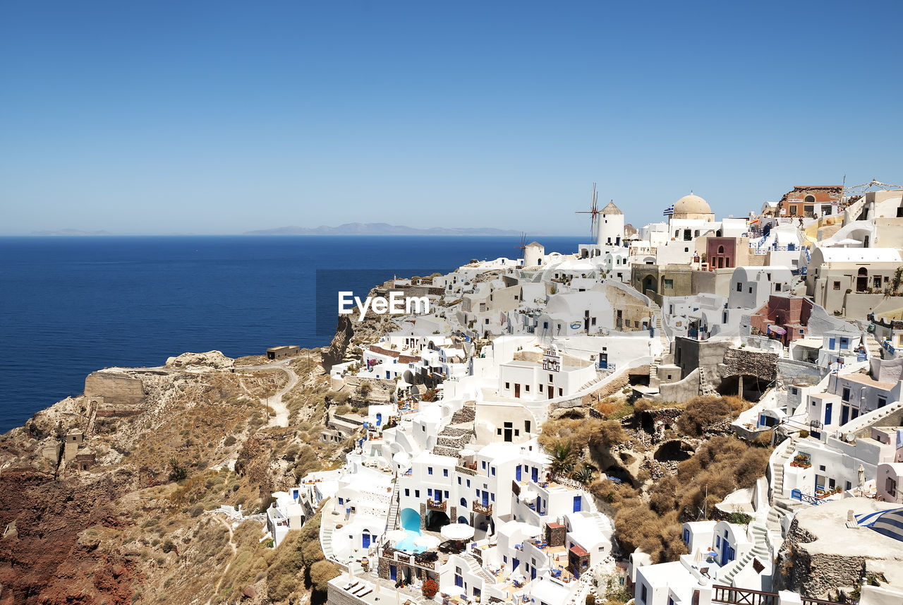 High angle view of oia village by sea at santorini