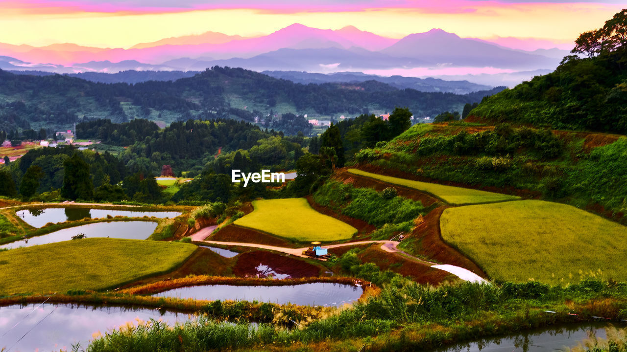 Scenic view of landscape and mountains against sky