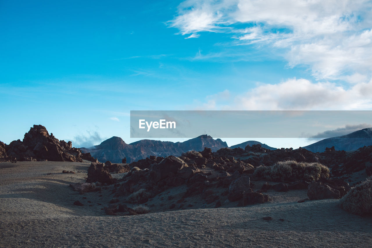 Scenic view of rocky mountains against sky