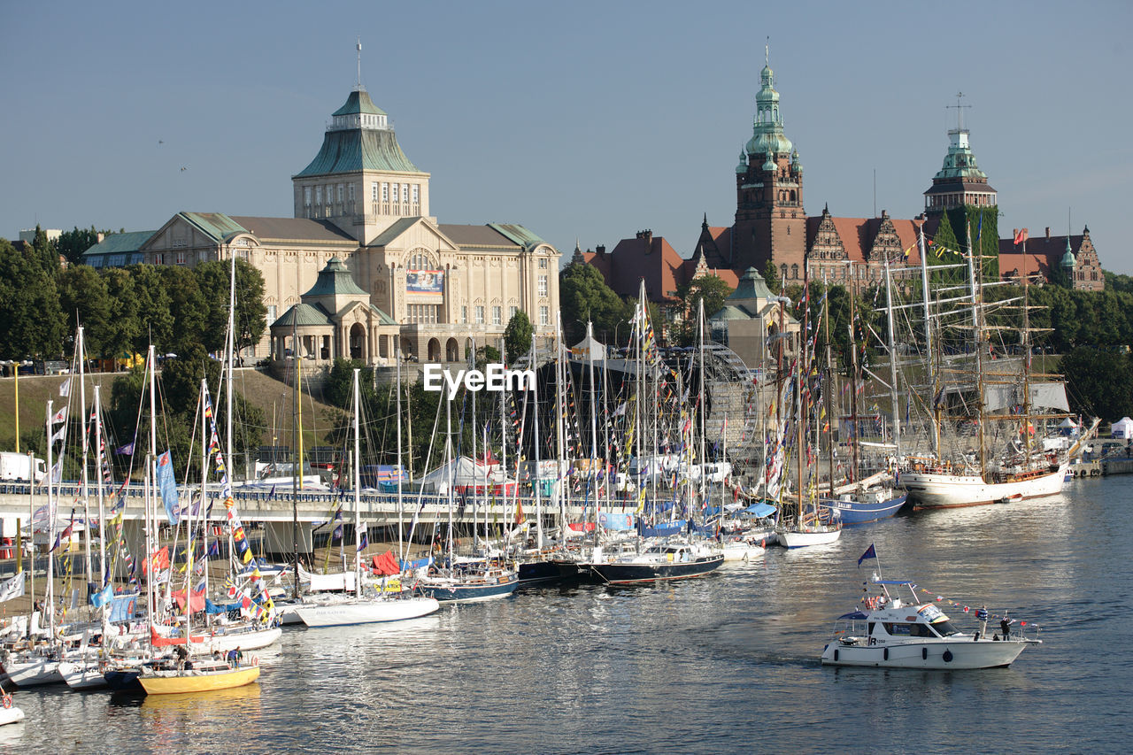 VIEW OF BOATS IN RIVER AGAINST SKY