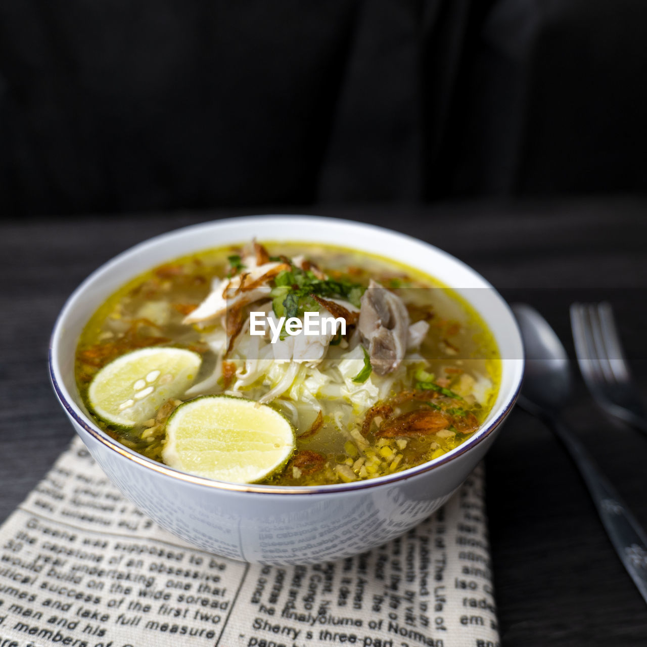Soto ayam, indonesian food, photographed with cutlery