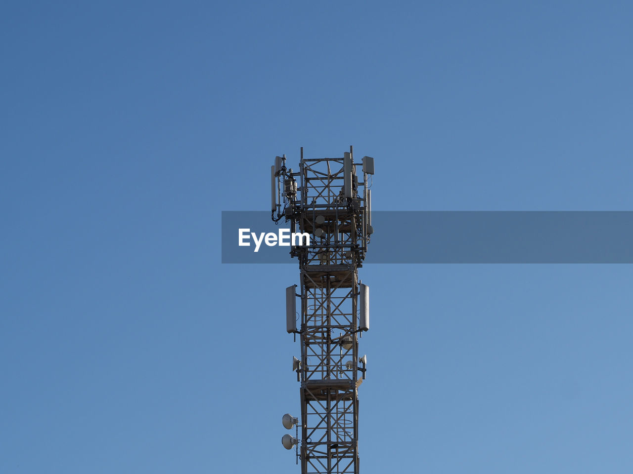 technology, sky, tower, communications tower, clear sky, blue, communication, built structure, broadcasting, antenna, wireless technology, global communications, architecture, no people, satellite dish, low angle view, copy space, satellite, electricity, metal, nature, telecommunications equipment, mast, telecommunications engineering, day, transmission tower, outdoors, overhead power line, sunny