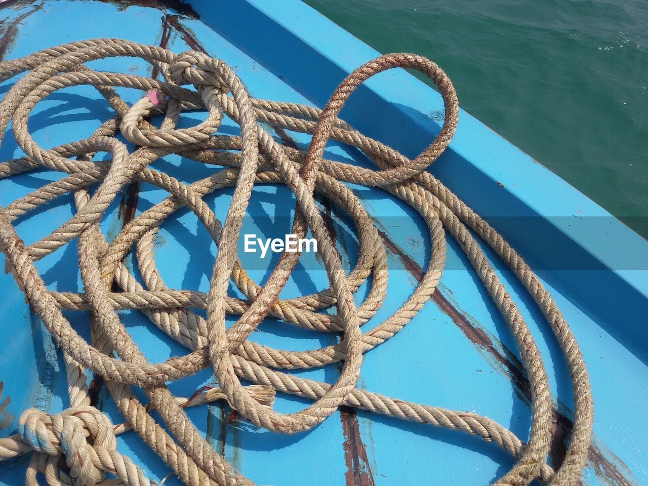 Close-up of rope against blue sky