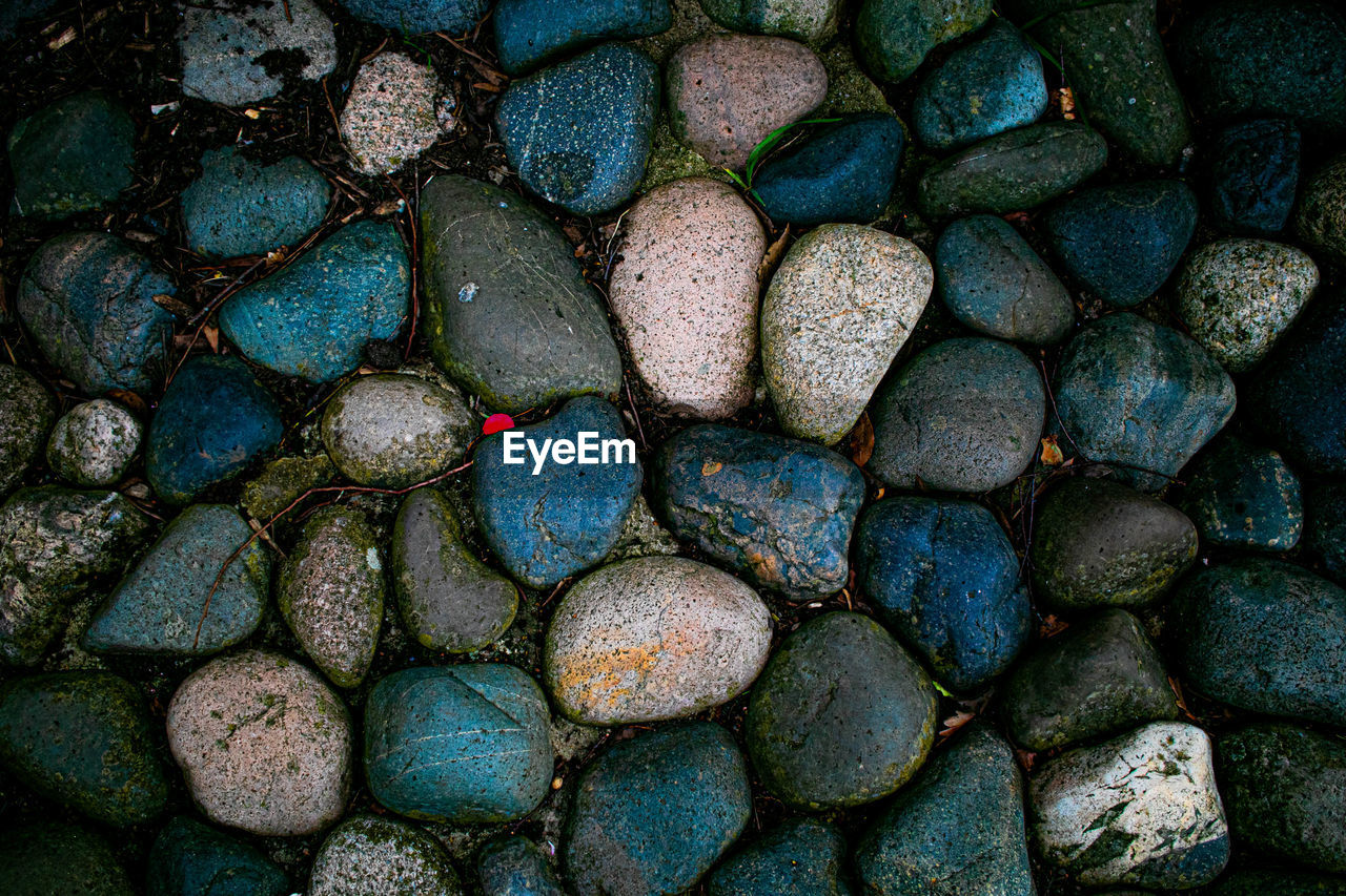 green, full frame, backgrounds, blue, multi colored, no people, rock, large group of objects, pattern, abundance, textured, close-up, pebble, soil, directly above, leaf, nature, stone, outdoors, shape