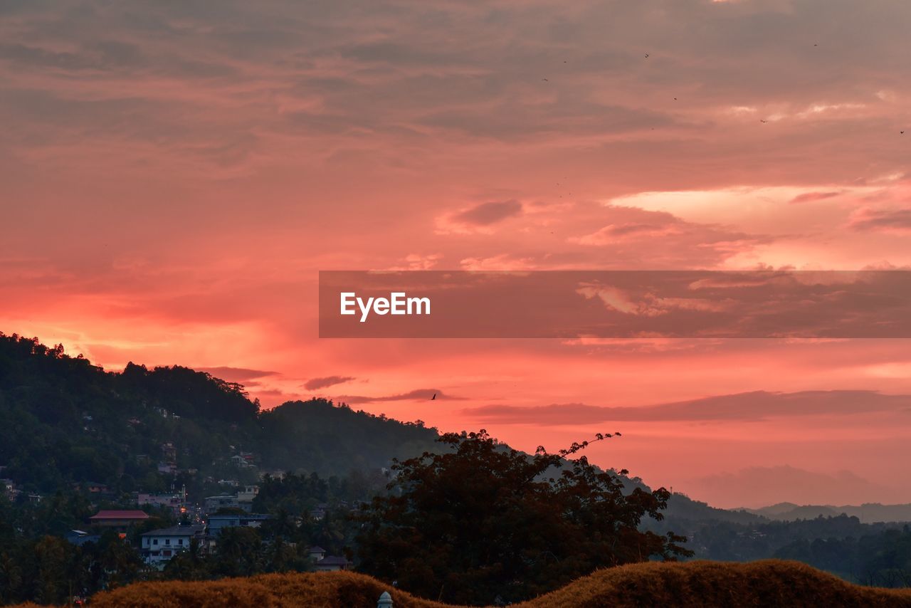 Scenic view of dramatic sky during sunset