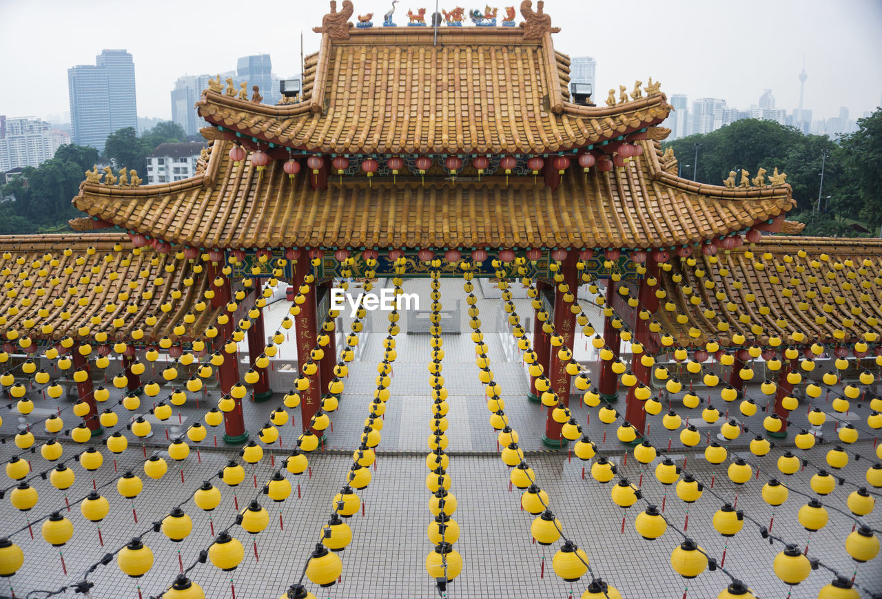 Yellow lanterns hanging at temple