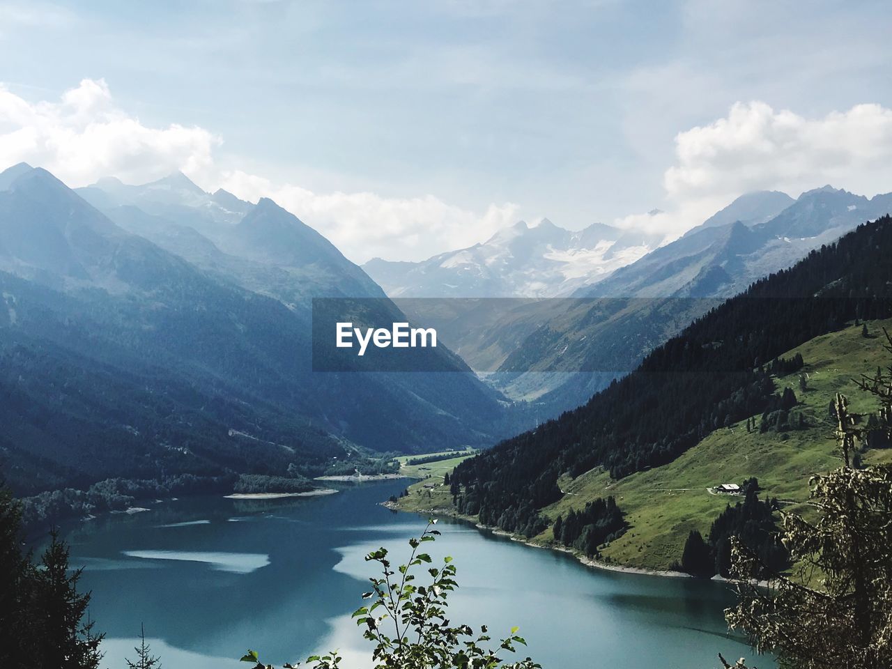 Scenic view of lake amidst mountains against sky