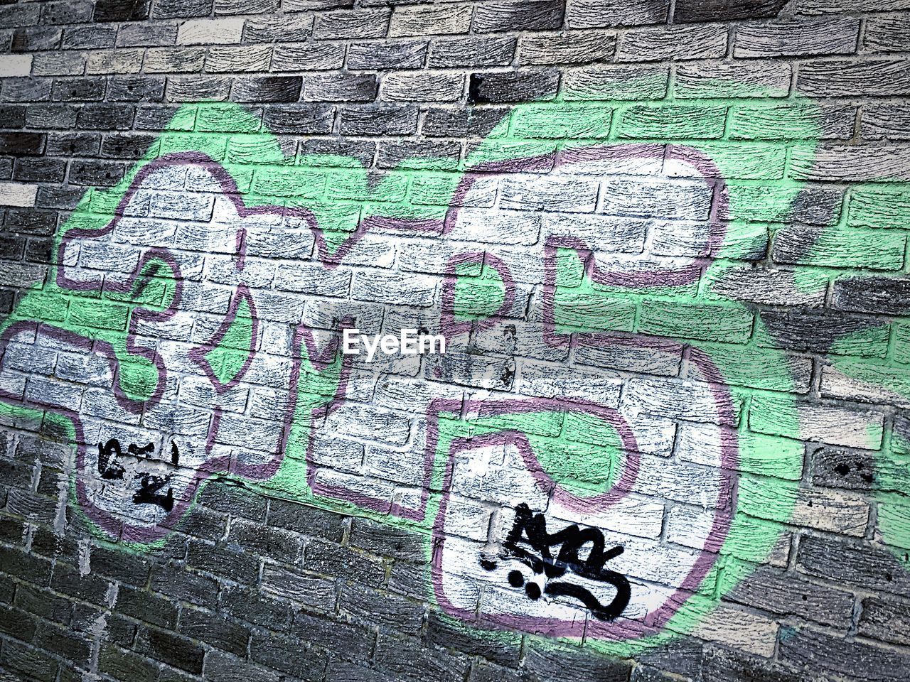 CLOSE-UP OF GRAFFITI ON WALL