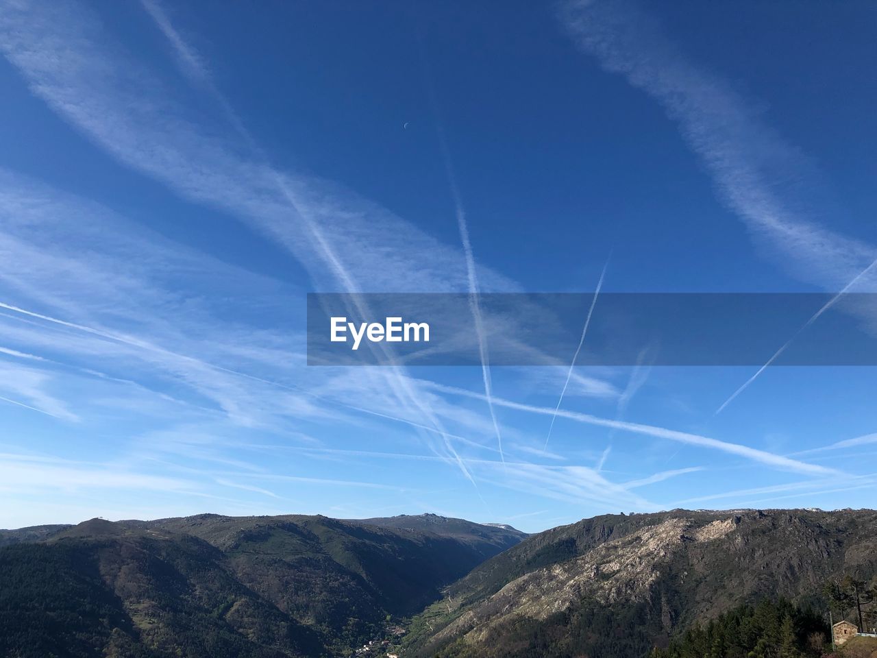 Low angle view of vapor trail in blue sky