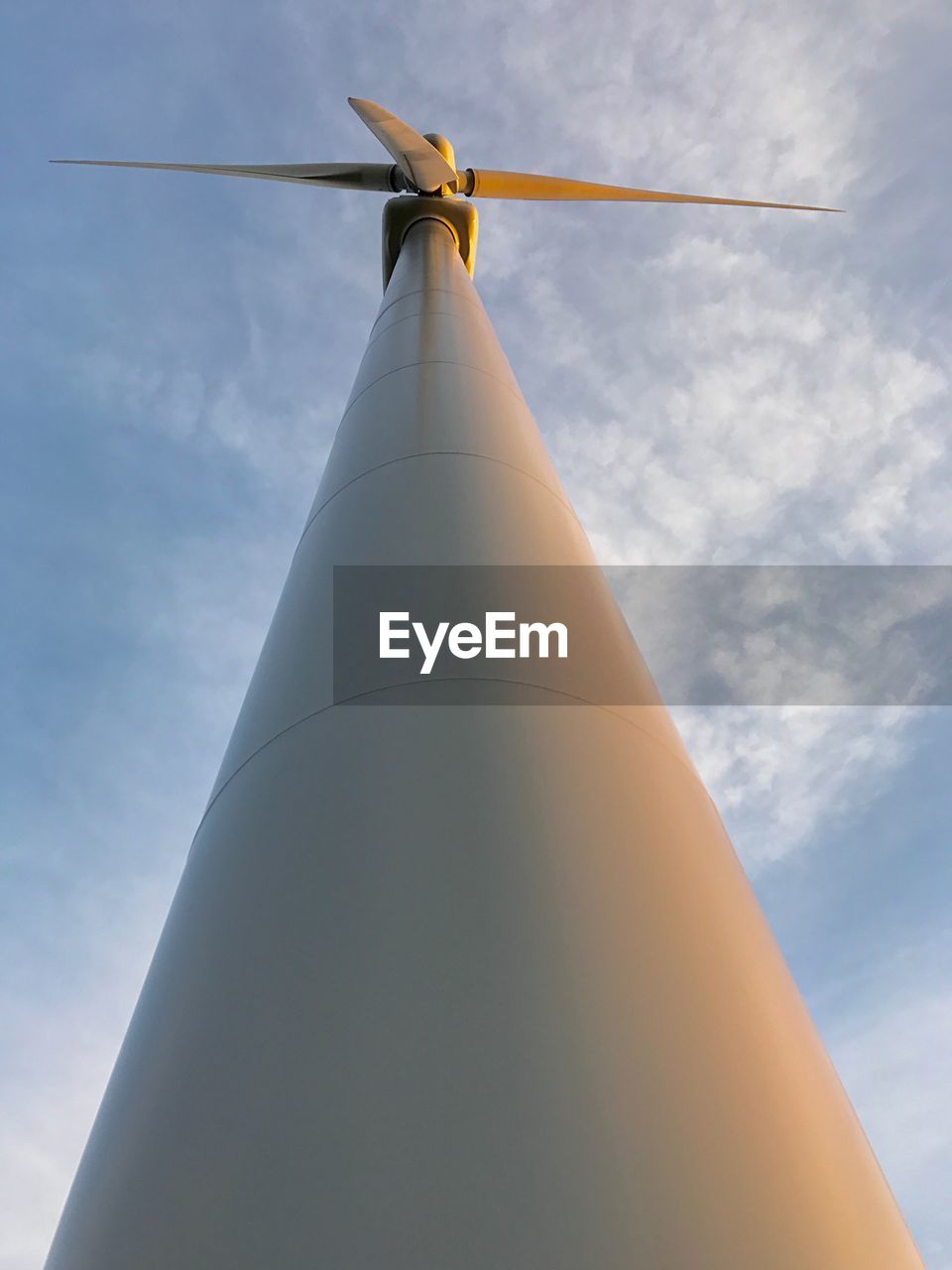 LOW ANGLE VIEW OF WINDMILLS AGAINST SKY