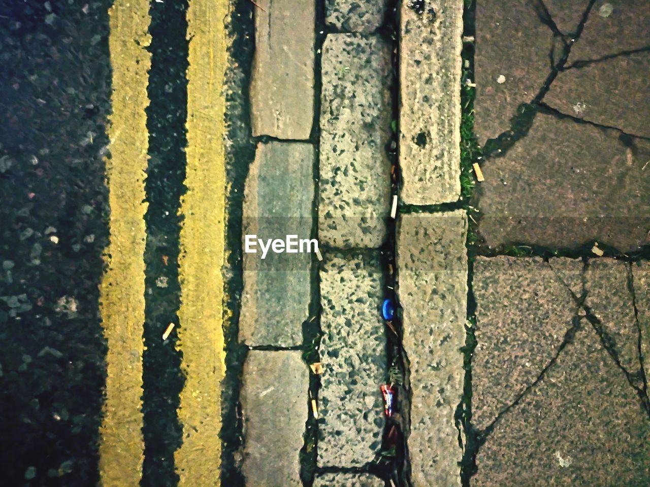 HIGH ANGLE VIEW OF ROAD WITH ARROW SYMBOL