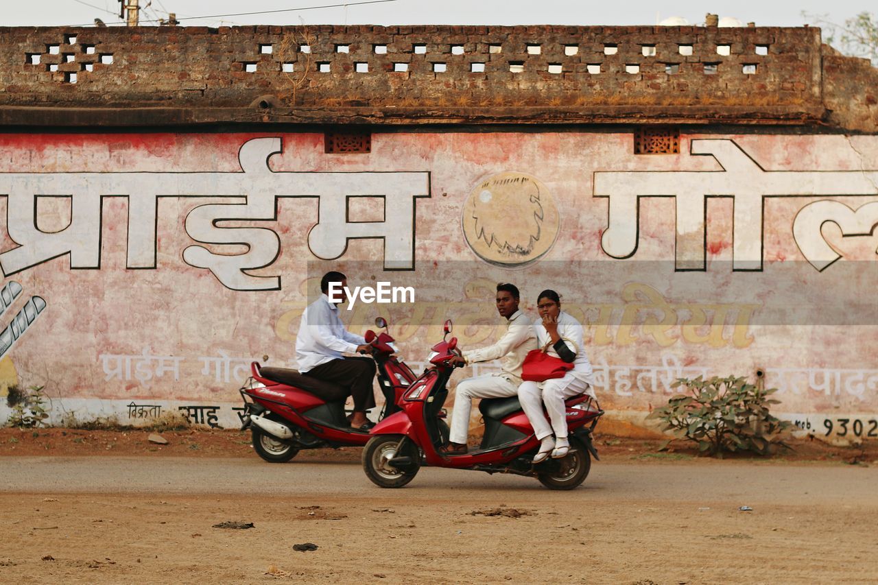 YOUNG MAN RIDING BICYCLE ON ROAD