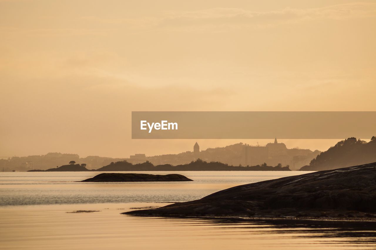 Scenic view of sea against sky during sunset