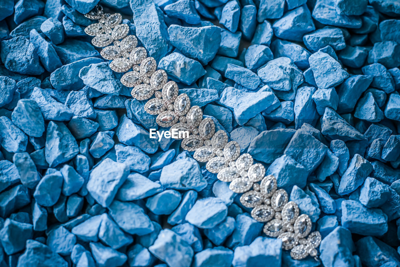 Full frame shot of jewelry on stones