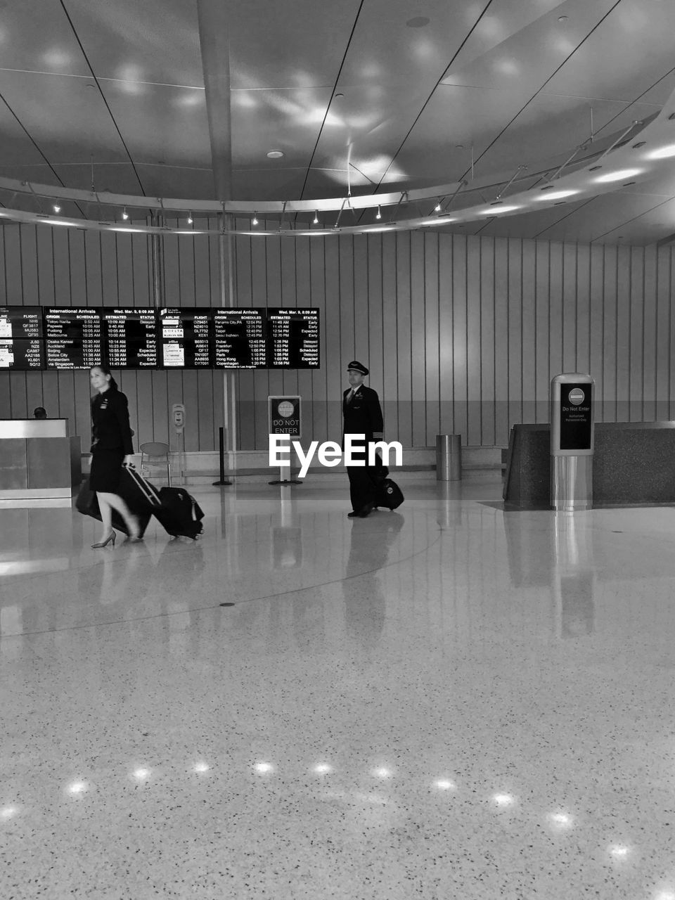 PEOPLE WALKING IN AIRPORT