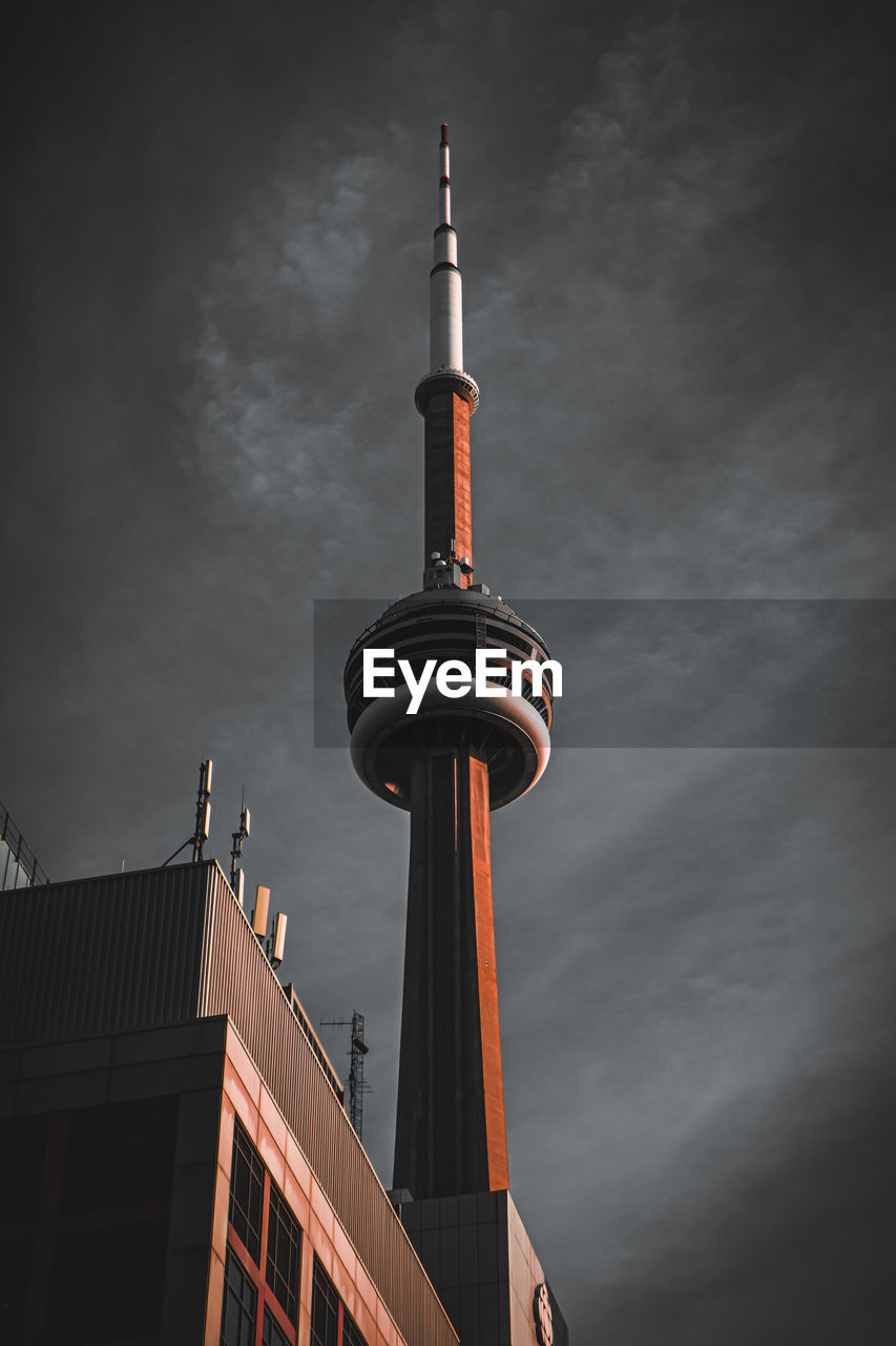 Low angle view of building against sky and cn tower
